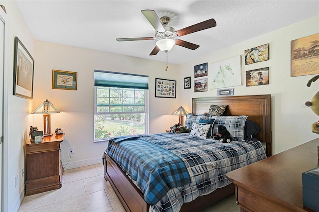 tiled bedroom with ceiling fan