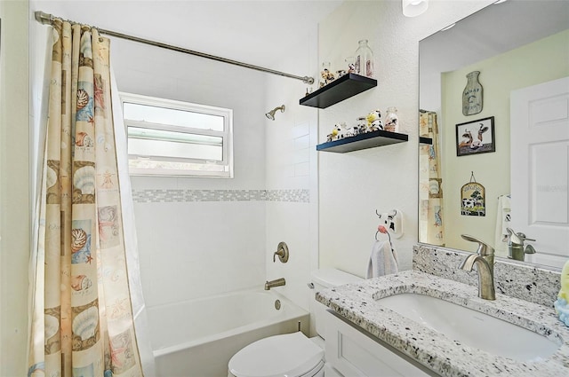 full bathroom with vanity, toilet, and shower / tub combo with curtain