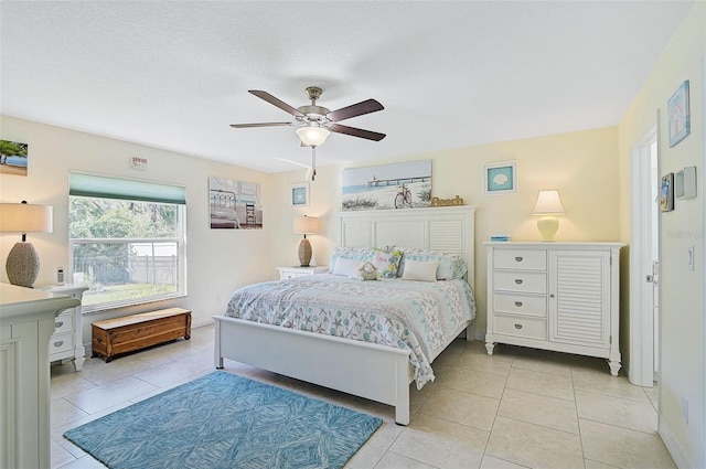 bedroom with light tile patterned floors and ceiling fan