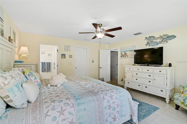 bedroom with ceiling fan and light tile patterned floors