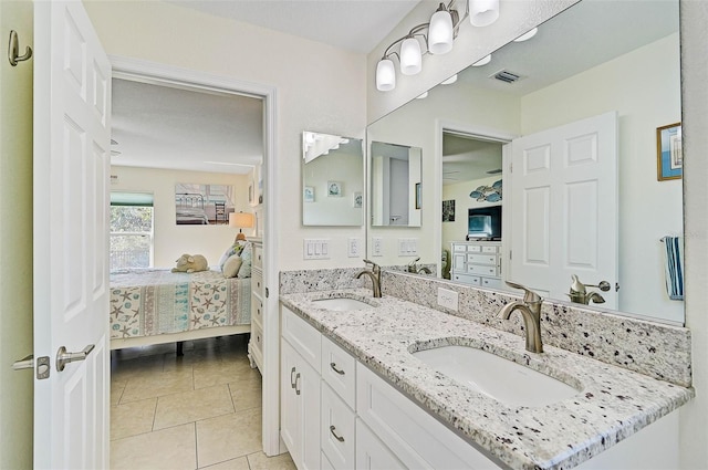 bathroom with vanity and tile patterned floors