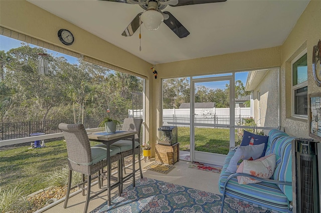 sunroom / solarium with ceiling fan