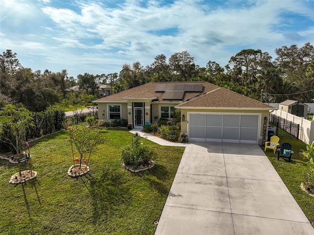 single story home with a garage, a front yard, and solar panels