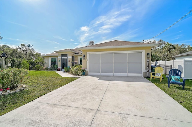 ranch-style house featuring a front lawn and a garage