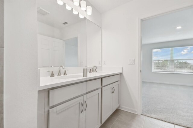 bathroom with vanity and tile patterned floors