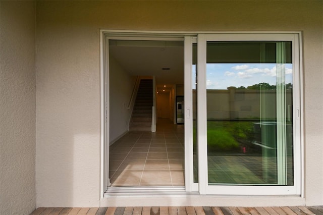 doorway to property with stucco siding