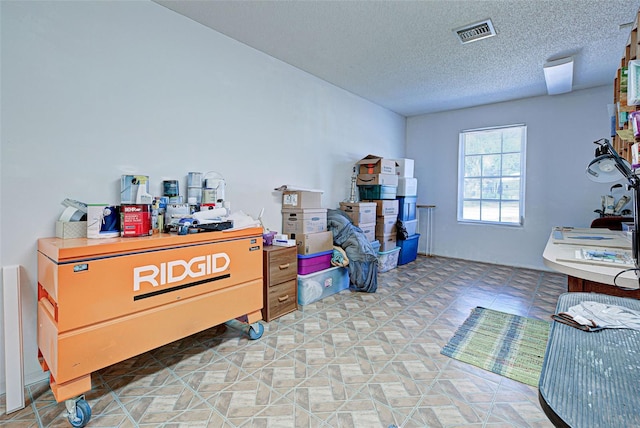 misc room featuring a textured ceiling