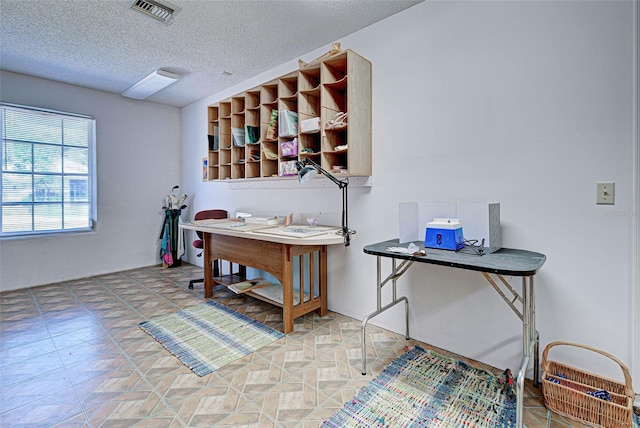 office space featuring a textured ceiling