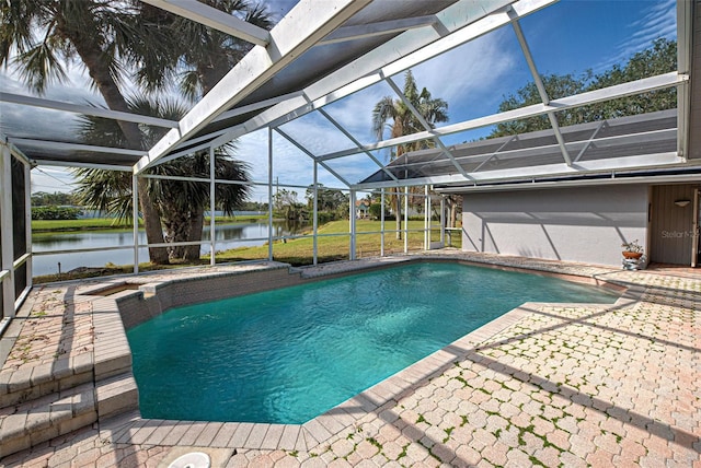 view of pool with a lanai, a water view, and a patio