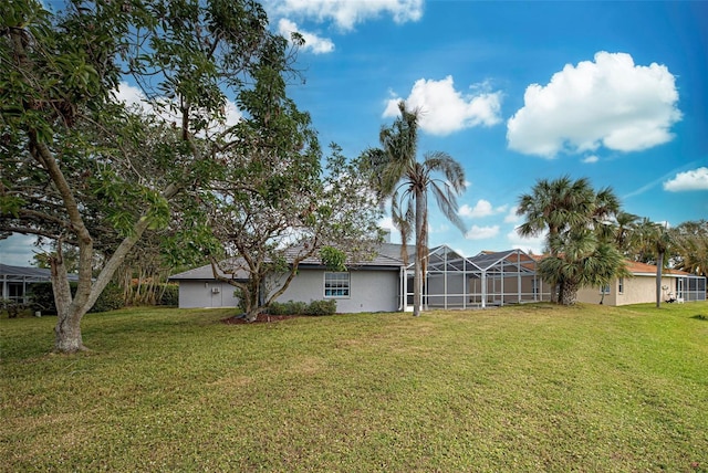 view of yard featuring a lanai