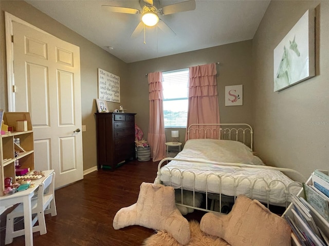 bedroom featuring dark wood-type flooring and ceiling fan