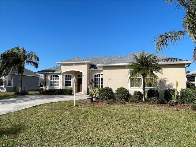 ranch-style house with a front lawn