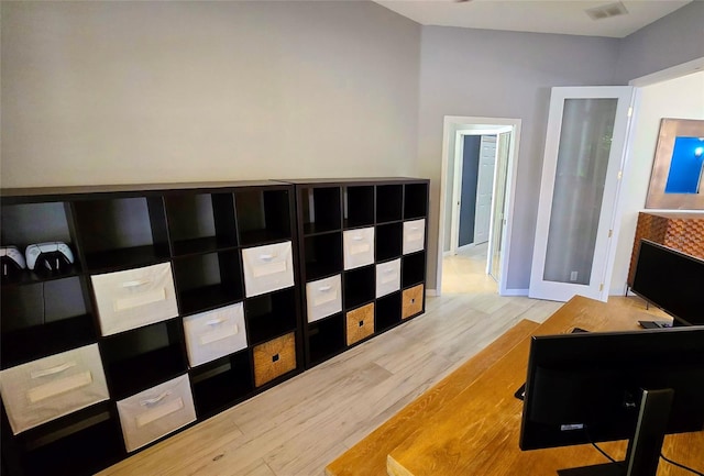 interior space featuring french doors and light hardwood / wood-style flooring