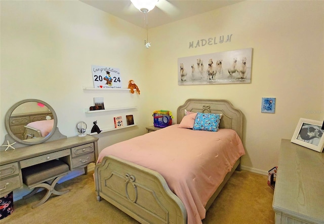 bedroom with ceiling fan and light colored carpet