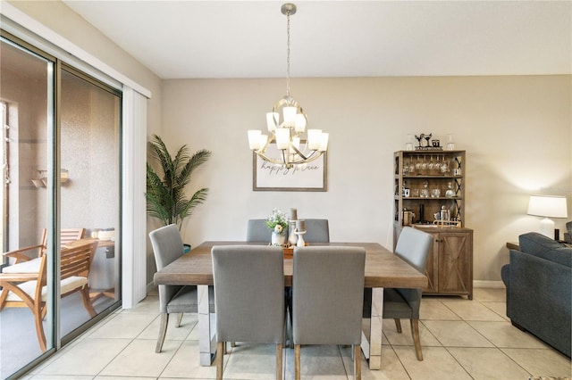 tiled dining area featuring a notable chandelier