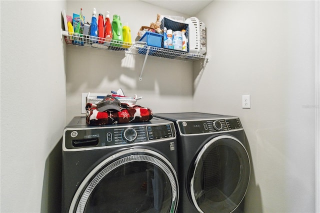 laundry area with washing machine and clothes dryer