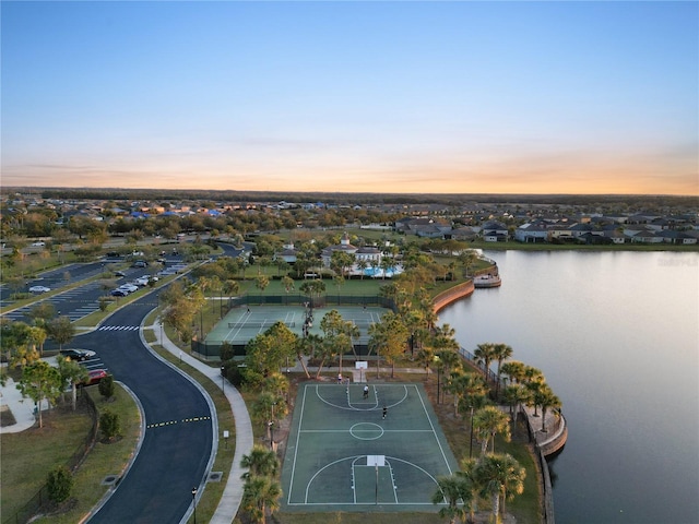 aerial view at dusk with a water view