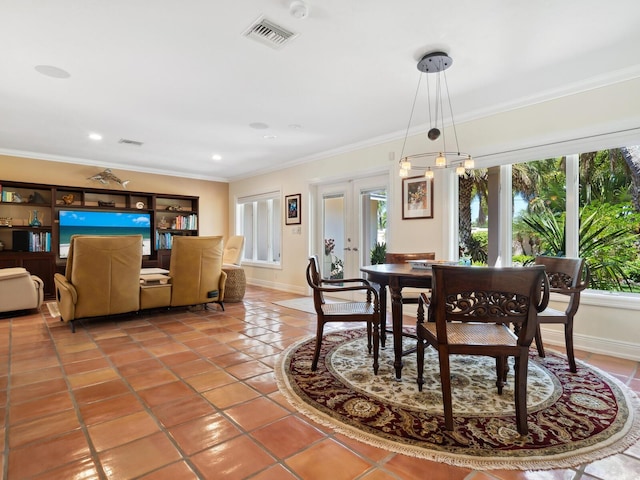 dining space with french doors, tile patterned floors, and ornamental molding