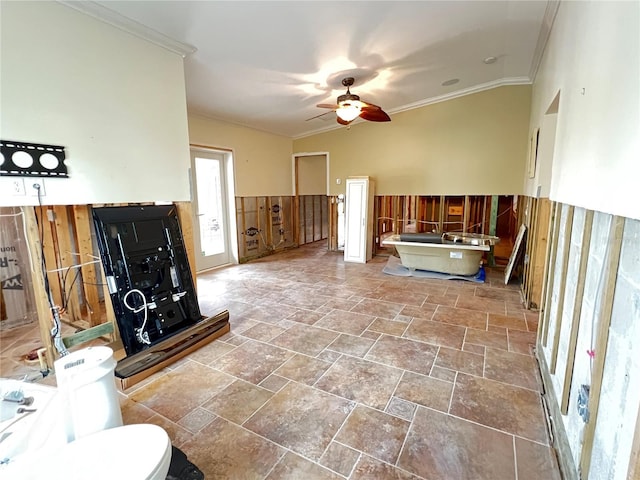 living room featuring ceiling fan and crown molding