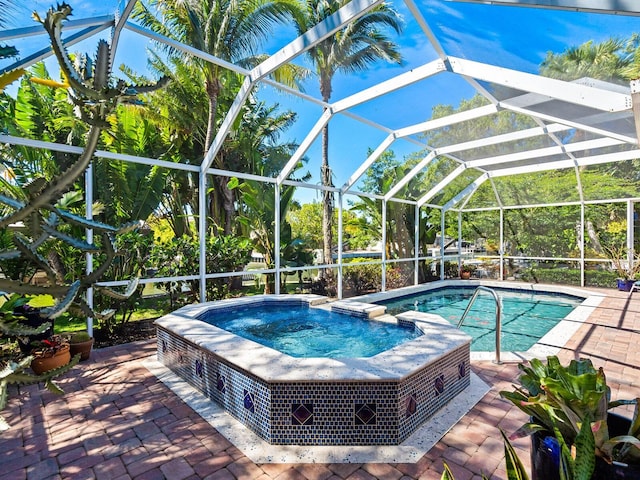 view of pool with a lanai and a patio