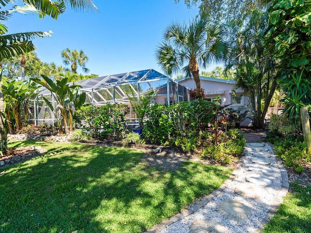 view of yard featuring glass enclosure