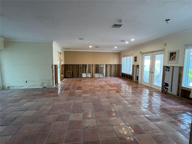 unfurnished living room with french doors and ornamental molding