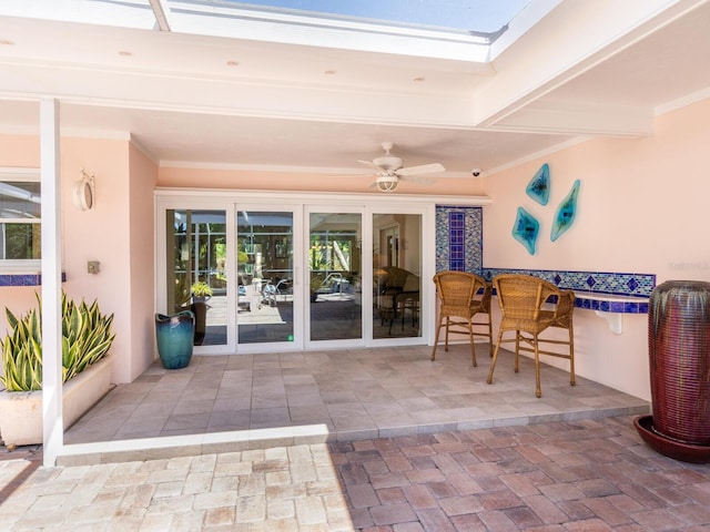 view of patio / terrace with french doors and ceiling fan