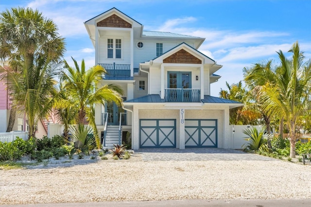 coastal inspired home featuring a garage