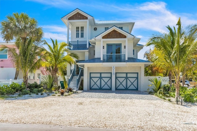 raised beach house with french doors and a garage