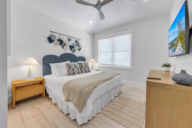 bedroom featuring ceiling fan, light hardwood / wood-style floors, lofted ceiling, and wooden ceiling