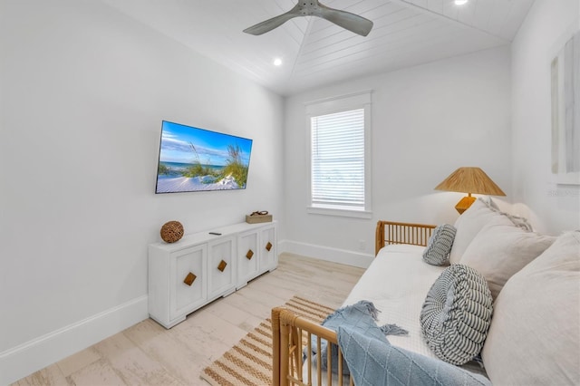 living room featuring light hardwood / wood-style flooring, vaulted ceiling, ceiling fan, and wood ceiling