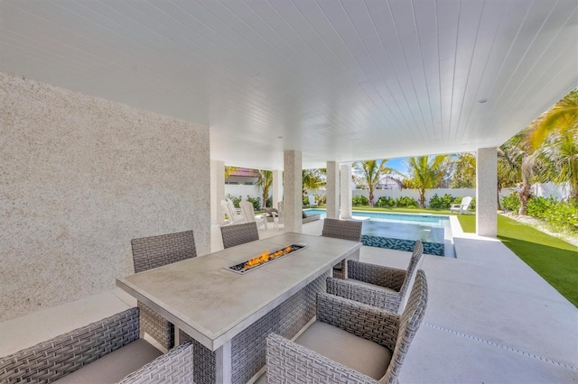 view of patio / terrace featuring an outdoor fire pit