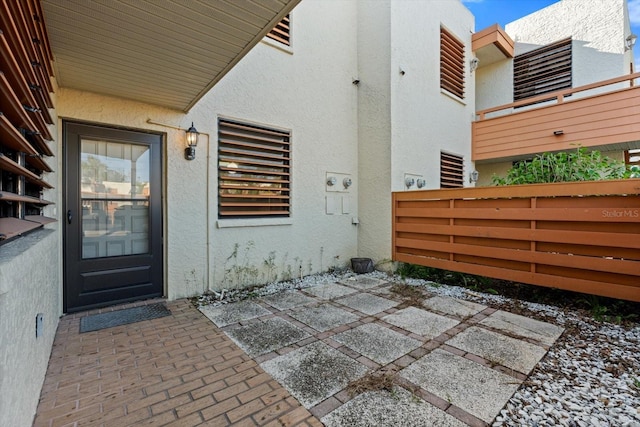 property entrance featuring a patio area