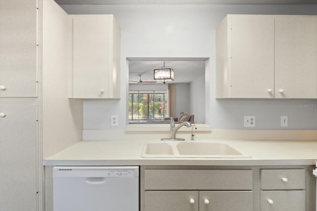 kitchen featuring white cabinetry, white dishwasher, and sink