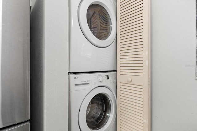 laundry room featuring stacked washer / dryer