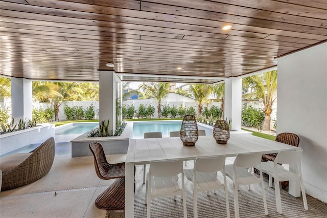 sunroom with a wealth of natural light and wood ceiling