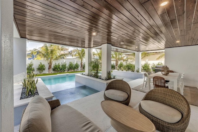 view of swimming pool with a patio area