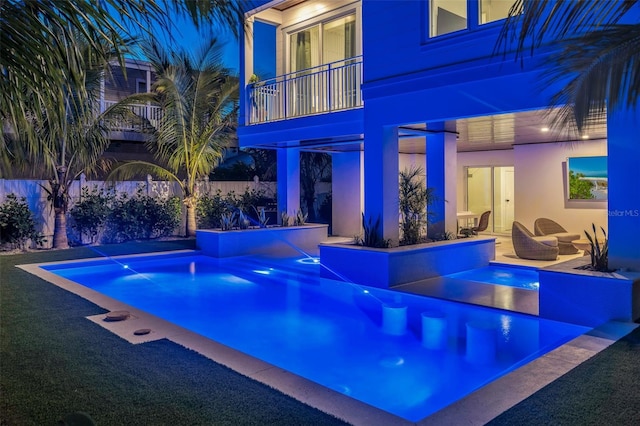 view of pool featuring pool water feature, a jacuzzi, and a patio