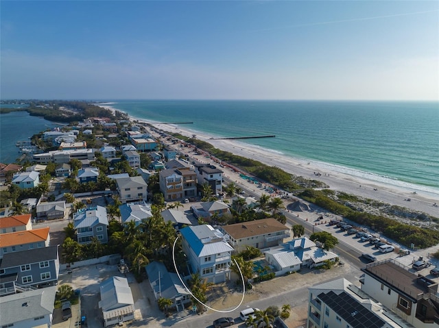 birds eye view of property featuring a water view and a view of the beach