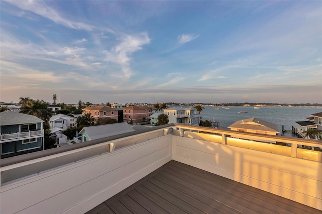 wooden terrace with a water view