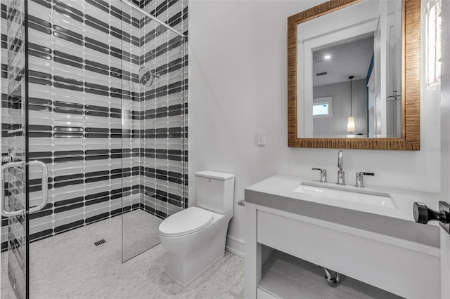 bathroom featuring tile patterned floors, vanity, an enclosed shower, and toilet