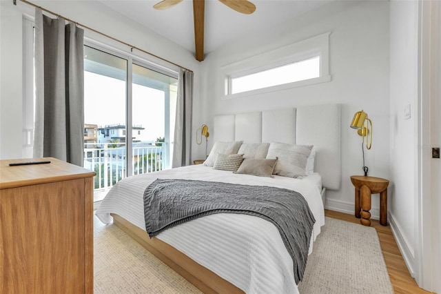 bedroom with ceiling fan, beam ceiling, light wood-type flooring, and access to outside