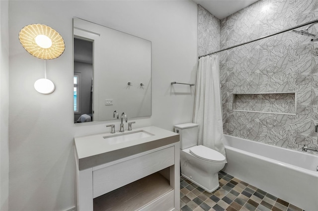 full bathroom featuring shower / bath combo, vanity, and toilet