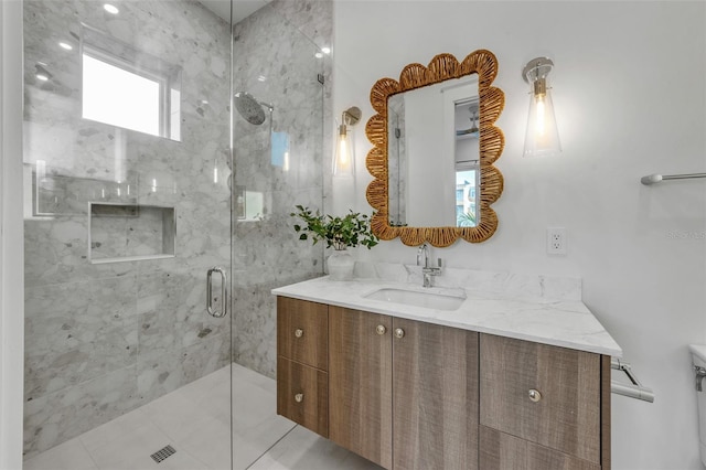 bathroom with tile patterned floors, vanity, and an enclosed shower