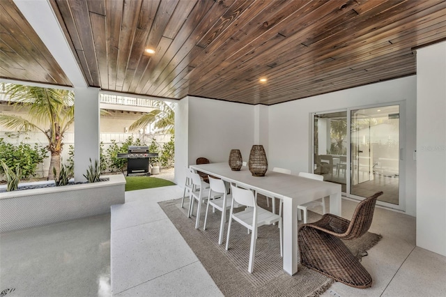 dining space with wooden ceiling