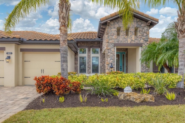 mediterranean / spanish-style home featuring a garage