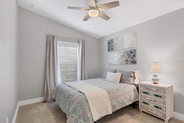 carpeted bedroom featuring ceiling fan and lofted ceiling