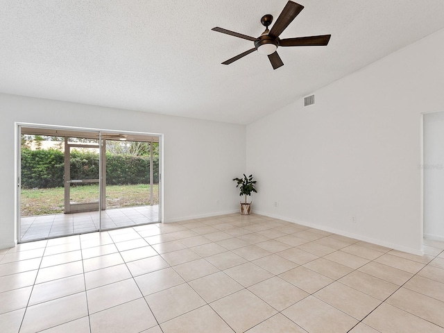 spare room featuring ceiling fan and light tile patterned floors