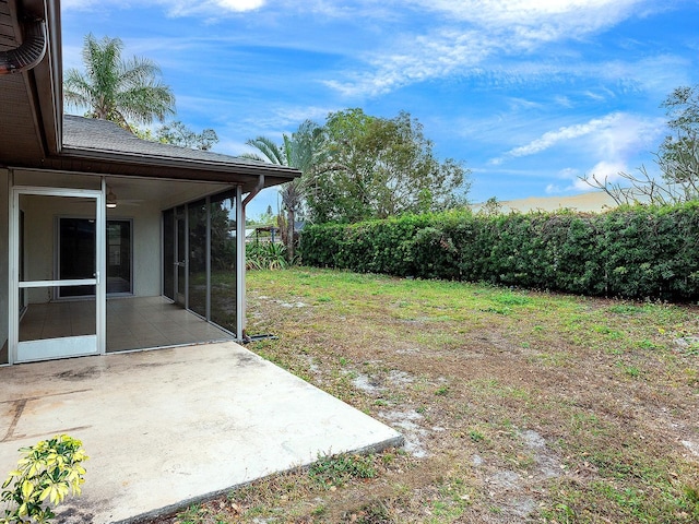 view of yard with a patio area and a sunroom