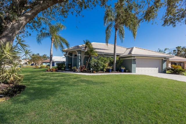 single story home featuring a garage and a front yard